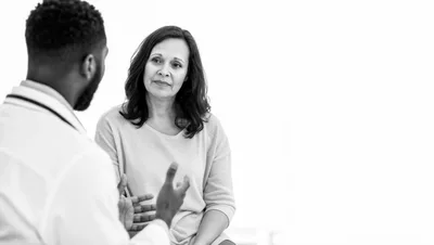 Doctor Consulting With A Patient In A Medical Office