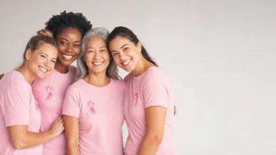 Diverse Women Wearing Pink Shirts for Breast Cancer Awareness