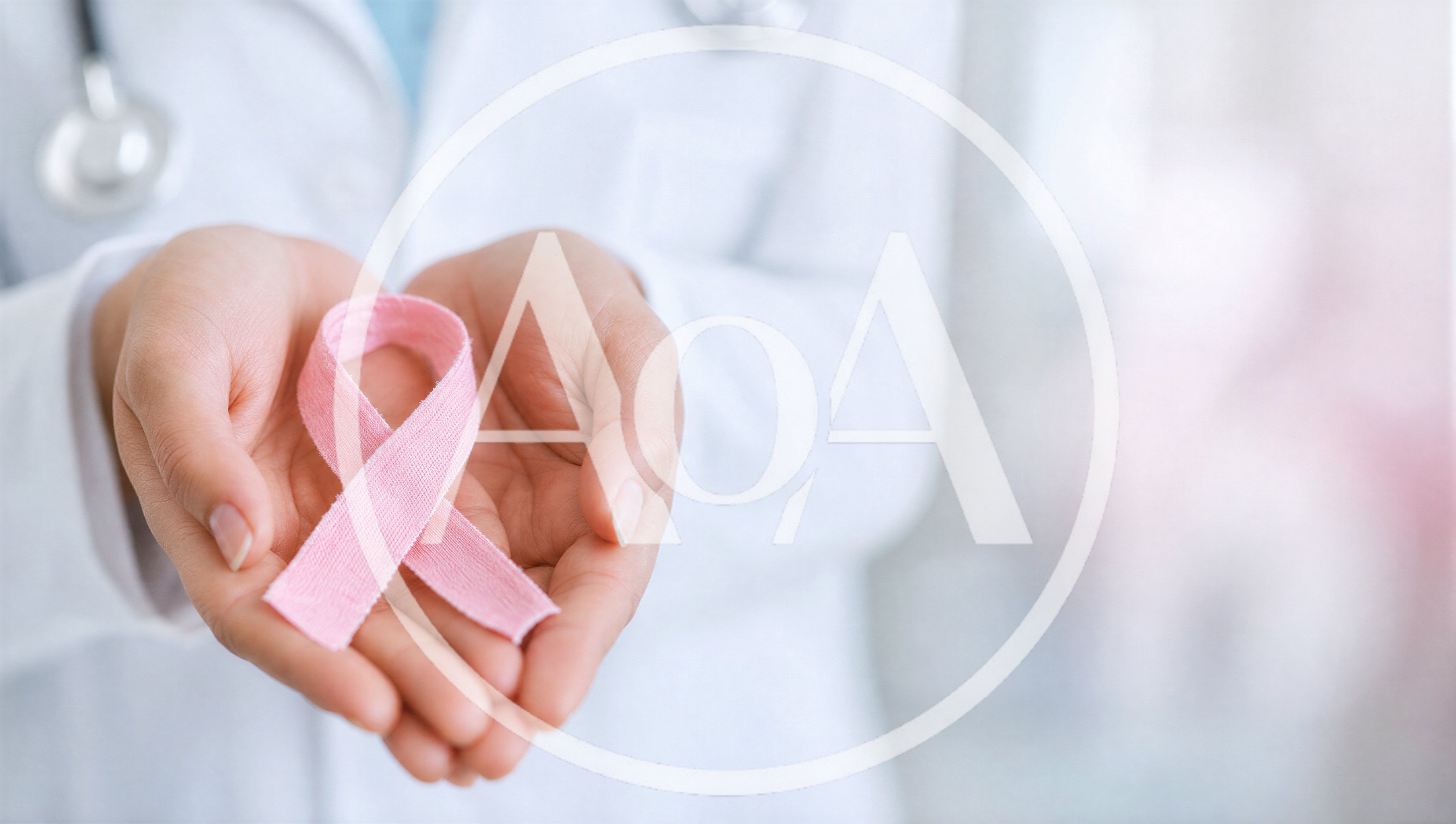 Doctor Holding Pink Breast Cancer Awareness Ribbon