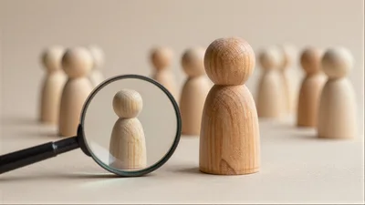 Wooden Peg Doll Under Magnifying Glass
