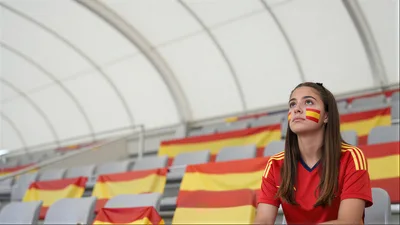 Young Spanish Soccer Fan Sitting In Stadium