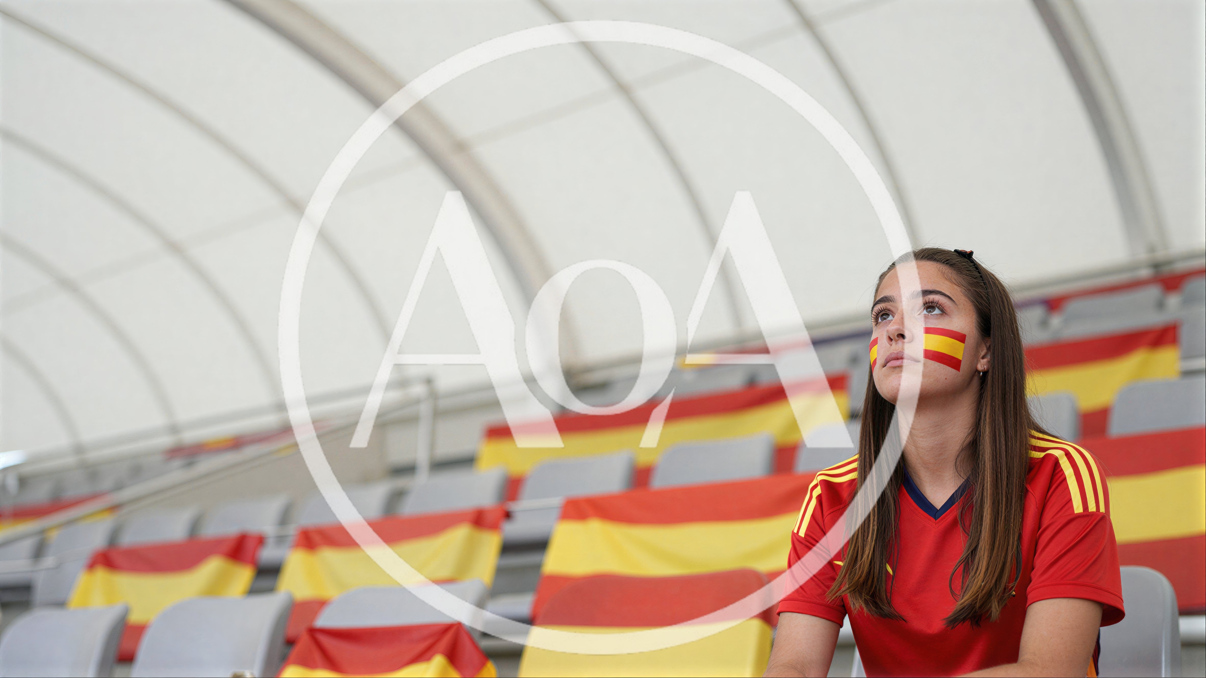 Young Spanish Soccer Fan Sitting In Stadium