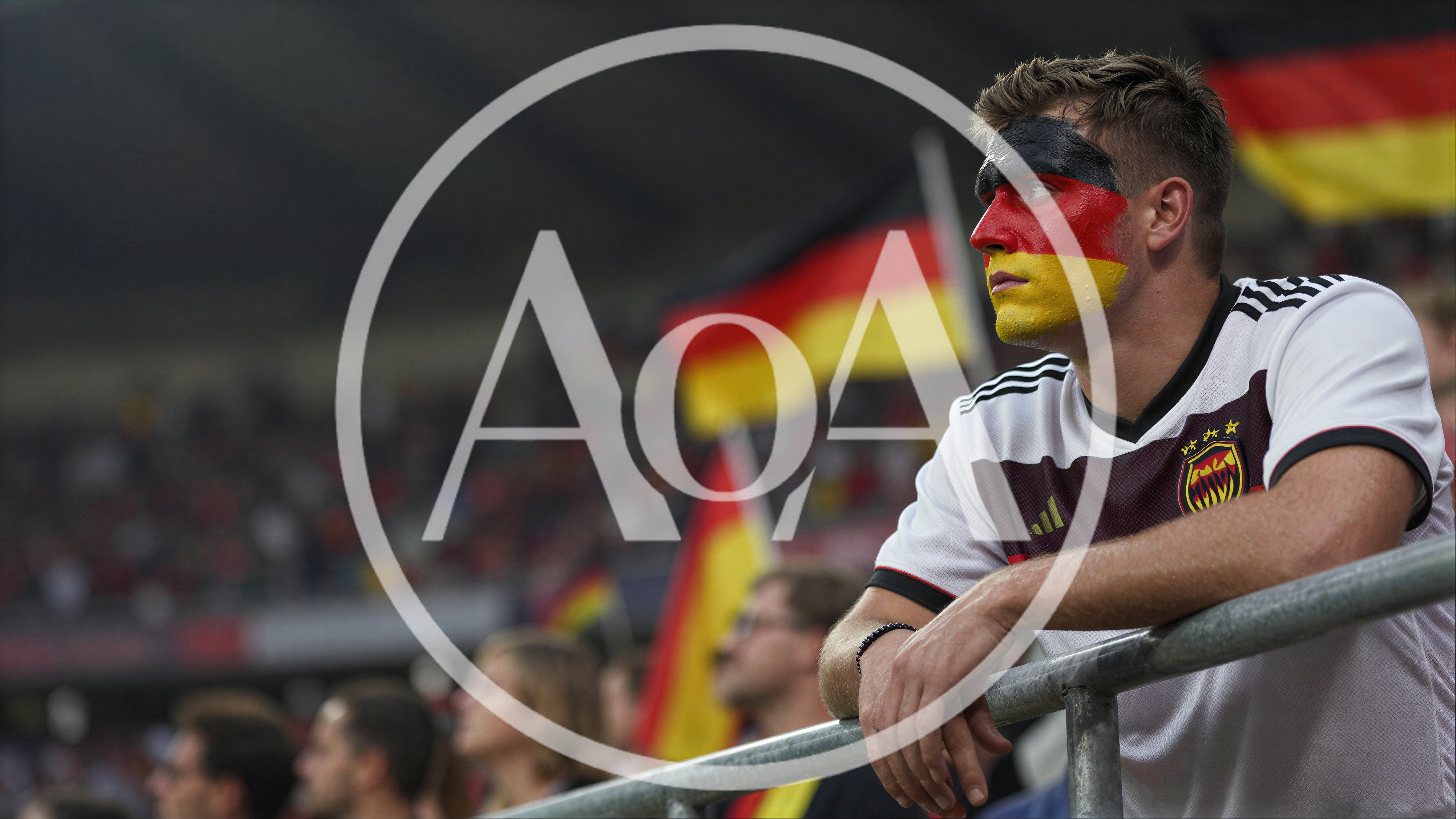 German Soccer Fan With Face Paint Watching Match