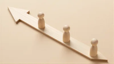 Wooden Peg Figures Standing On A Directional Arrow