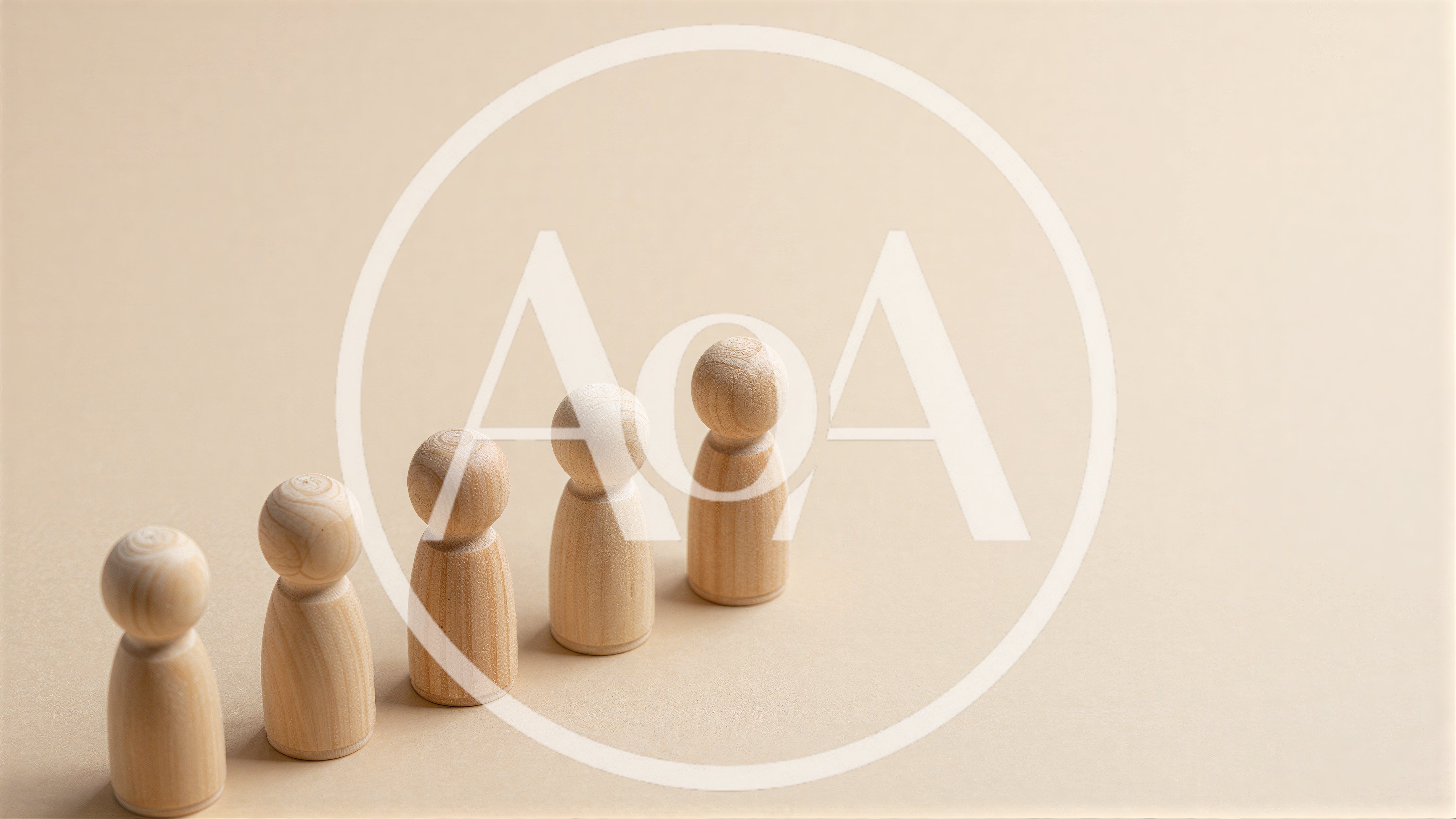 Five Wooden Peg Dolls Arranged In A Row