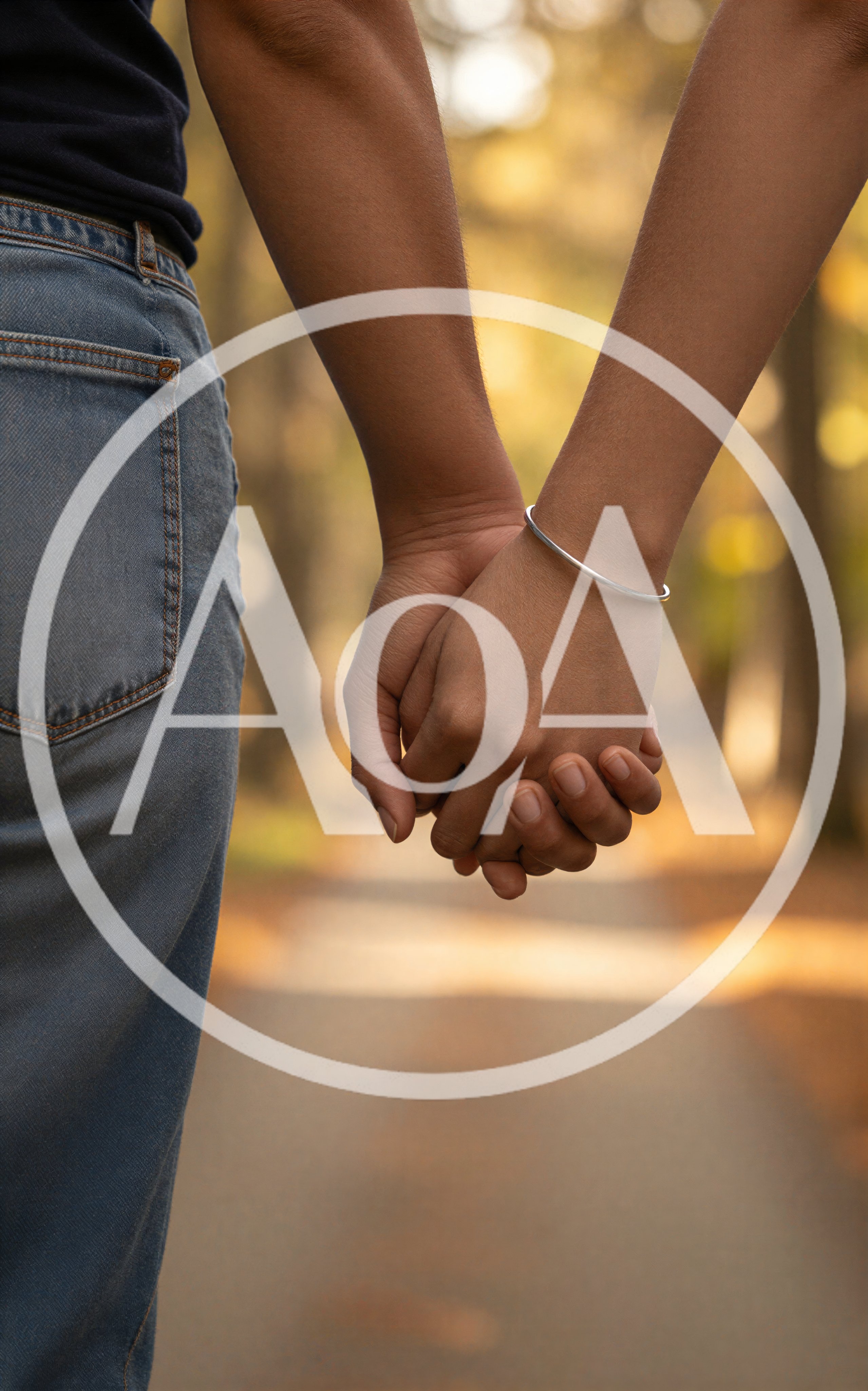 Couple Holding Hands While Walking Outdoors