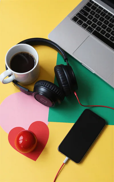 Work Desk Setup With Laptop Coffee And Headphones