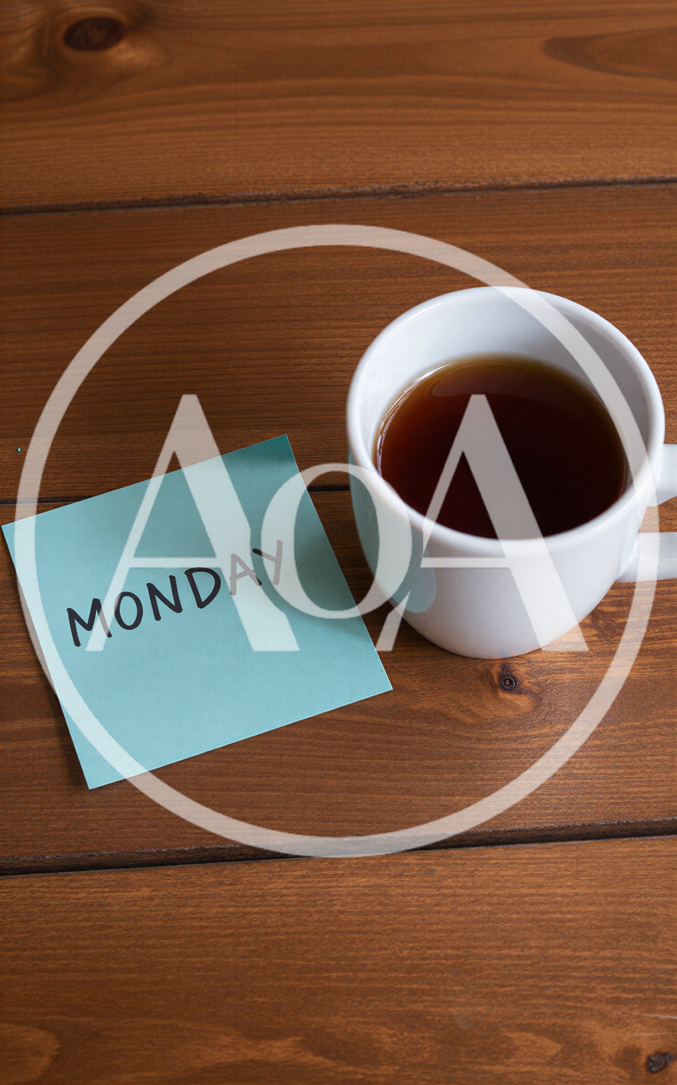 Monday Note and Coffee Cup on Wooden Table