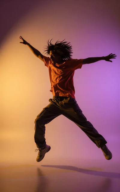 Young Man Performing Dynamic Dance Jump