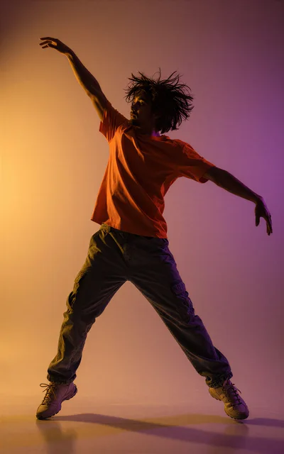 Young Man Performing Dynamic Contemporary Dance Jump