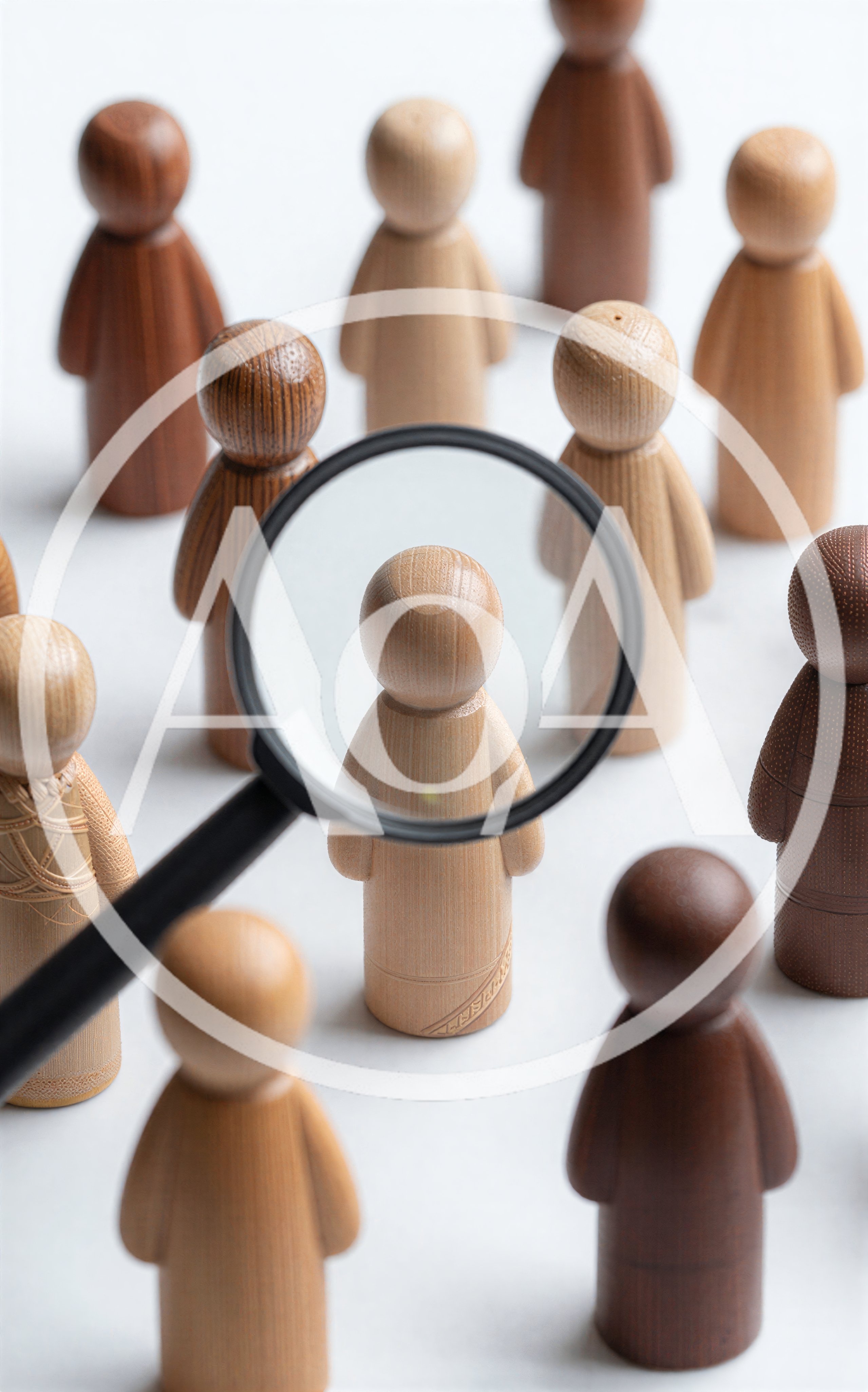 Magnifying Glass Focusing On A Wooden Figurine