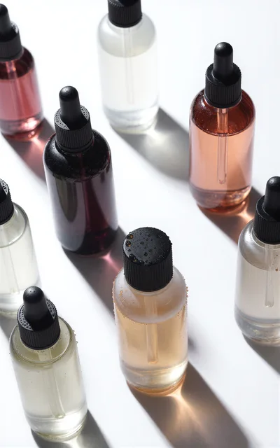 Assorted Skincare Serum Bottles On White Background