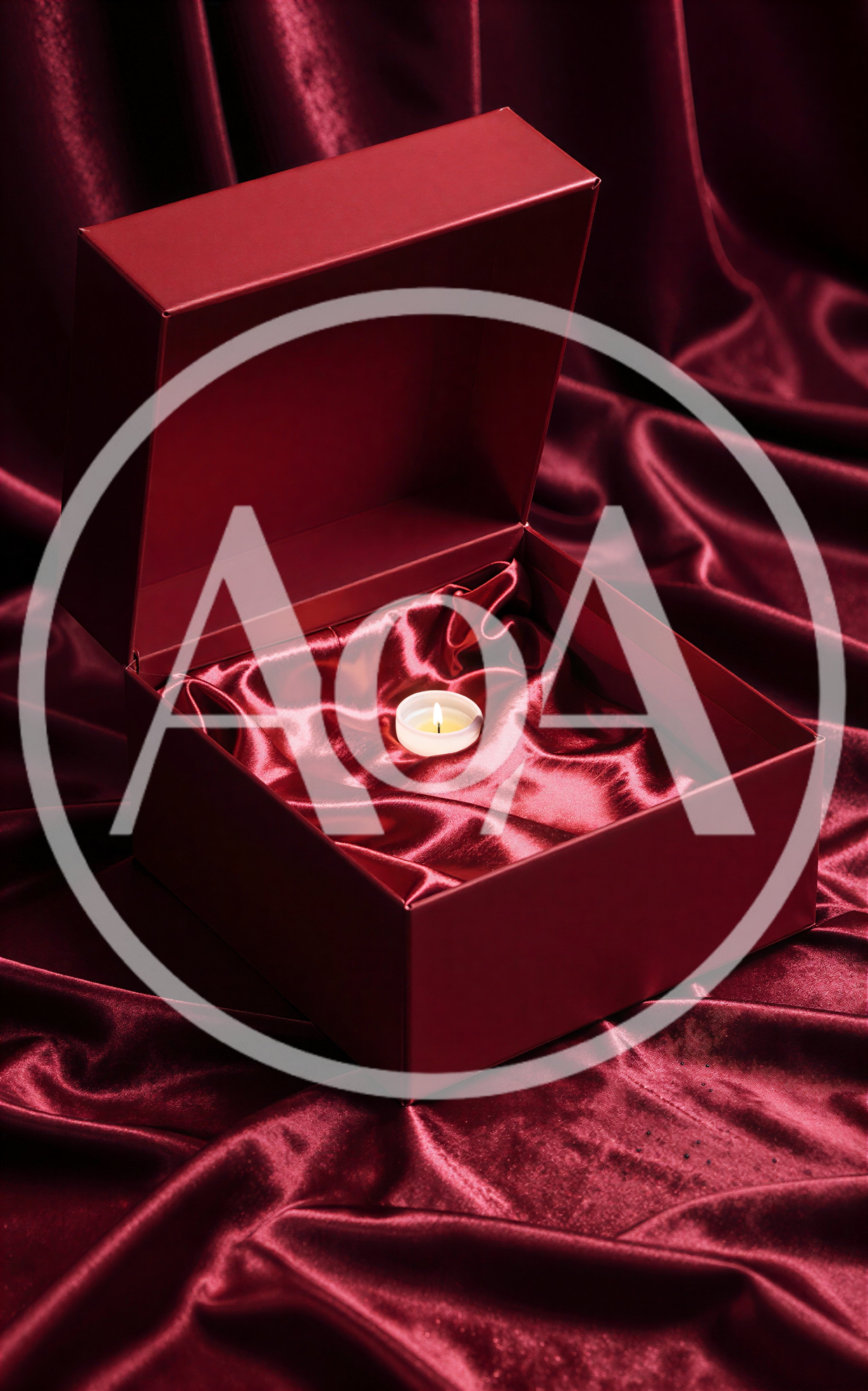 Small Lit Candle Inside An Open Red Gift Box