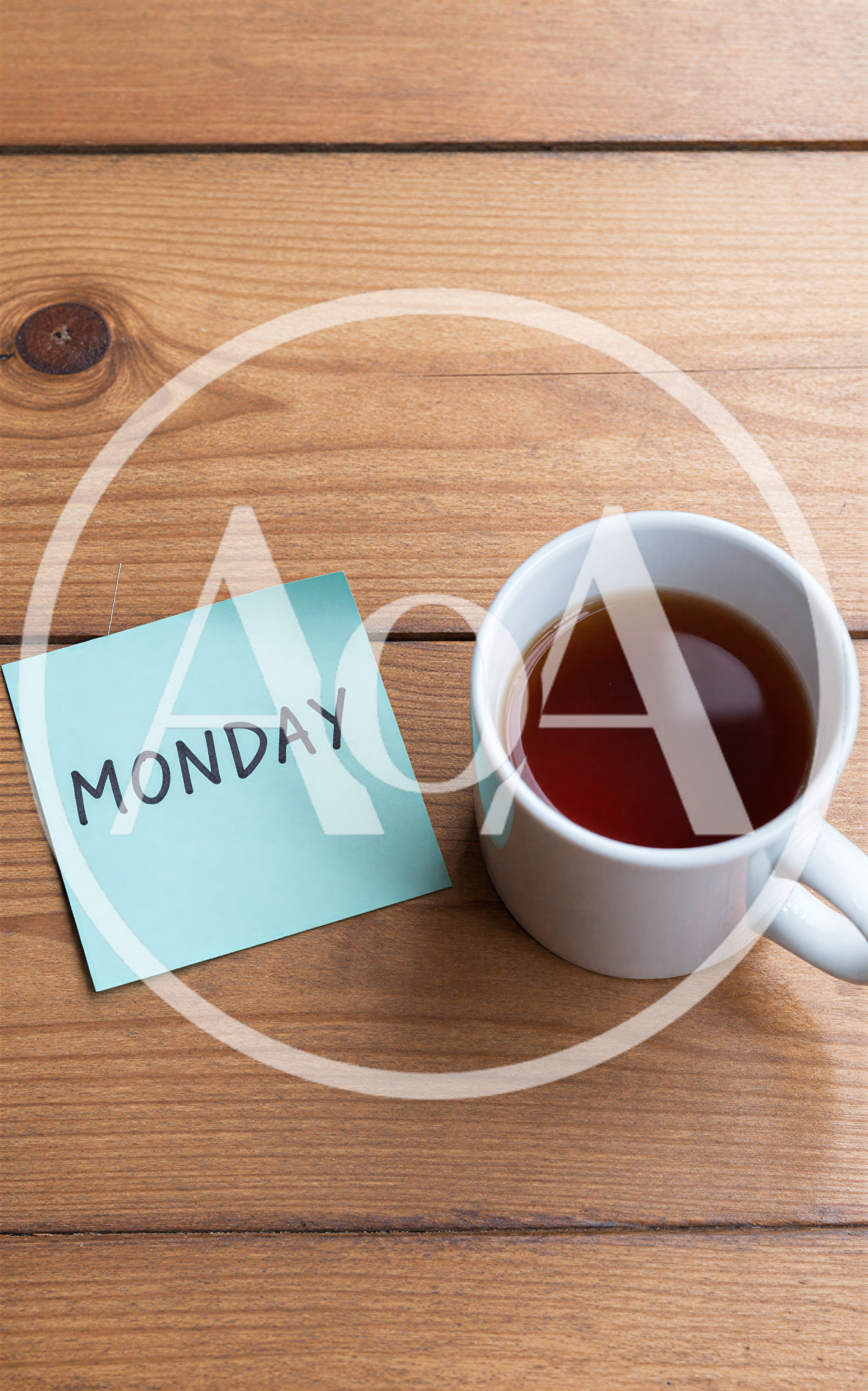 Monday Note And A Cup Of Tea On Wooden Table