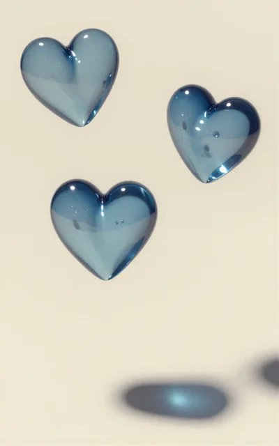 Three Floating Translucent Blue Glass Hearts