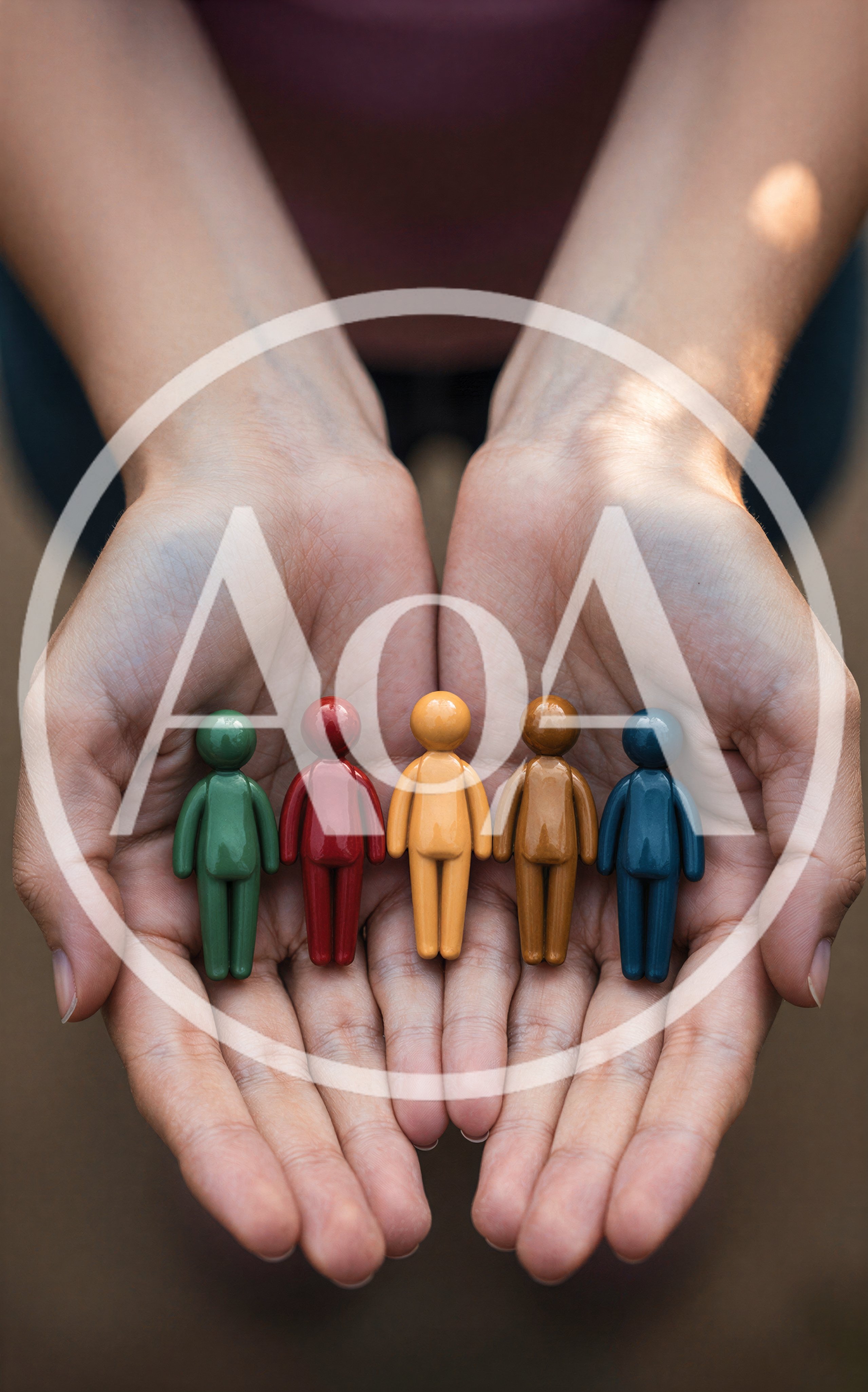 Hands Holding Five Colorful Human Figurines
