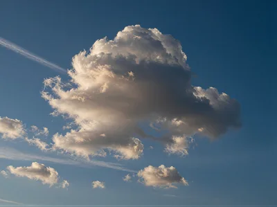 Single Large Cumulus Cloud Against Deep Blue Sky