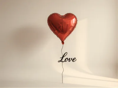 Red Heart Shaped Balloon With Love Text