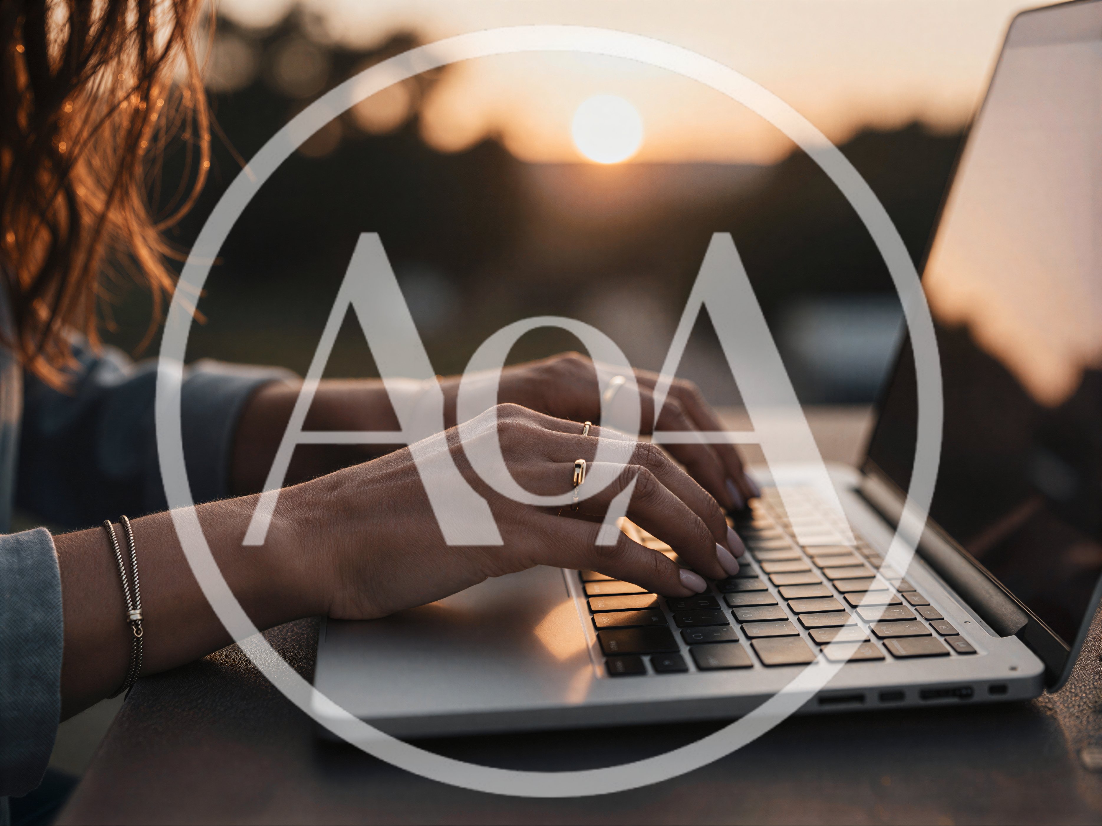 Woman Typing On Laptop During Golden Hour Sunset