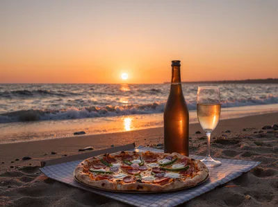 Pizza And Wine On A Beach At Sunset