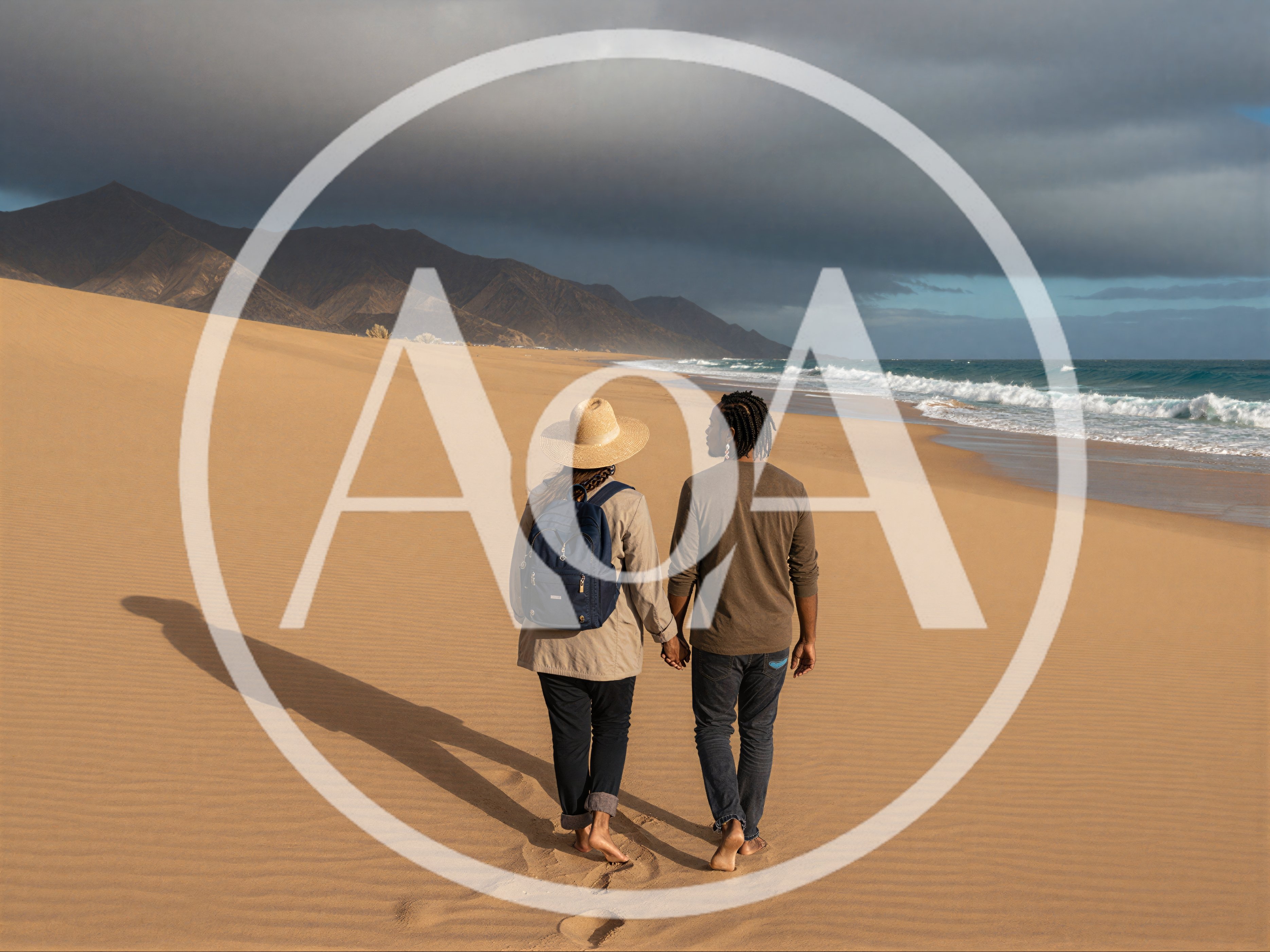 Couple Walking Hand In Hand On Sandy Beach