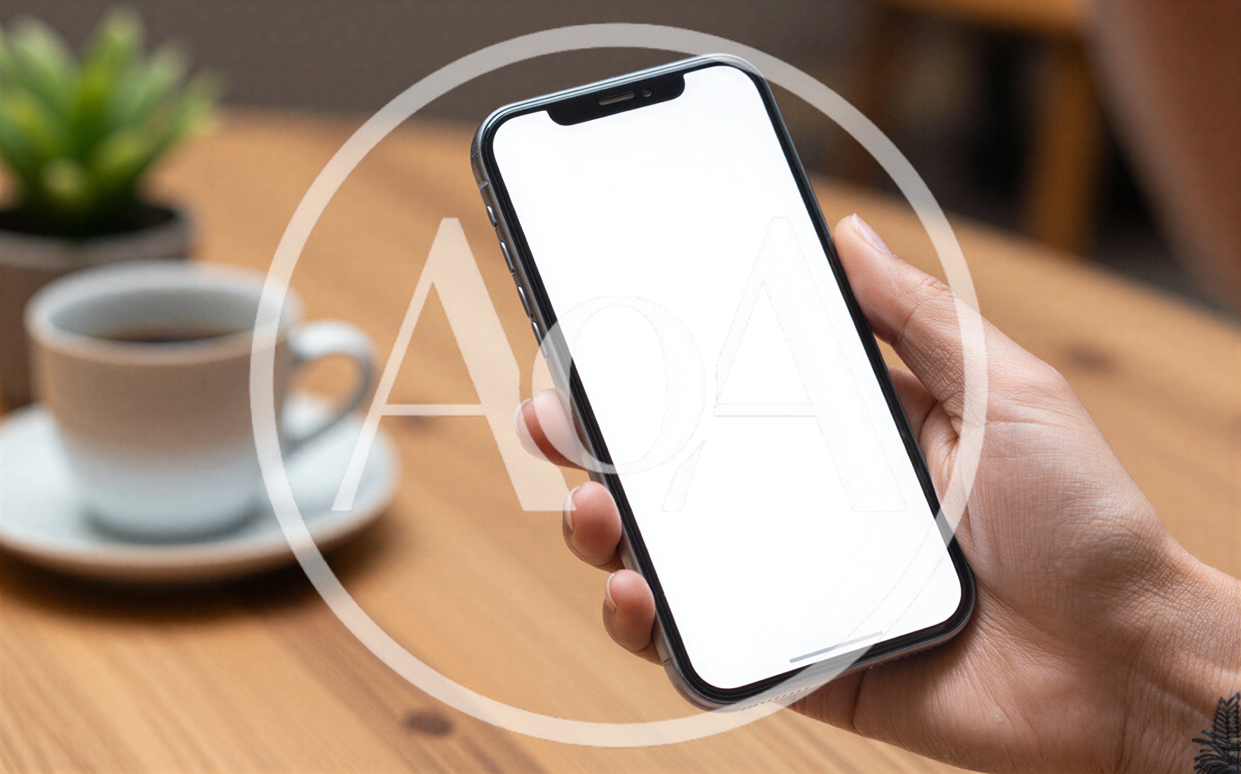 Person Holding Smartphone With Blank Screen At Cafe
