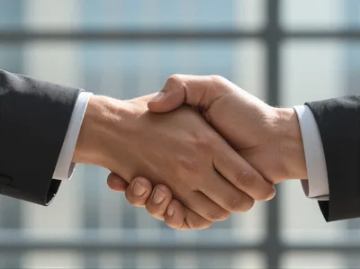 Professional Business Handshake Between Two Partners