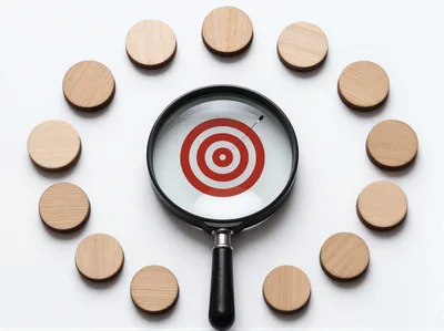 Magnifying Glass Focusing On A Red Target Symbol