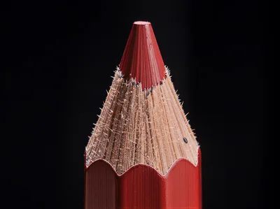 Macro Close Up Of A Sharpened Red Pencil