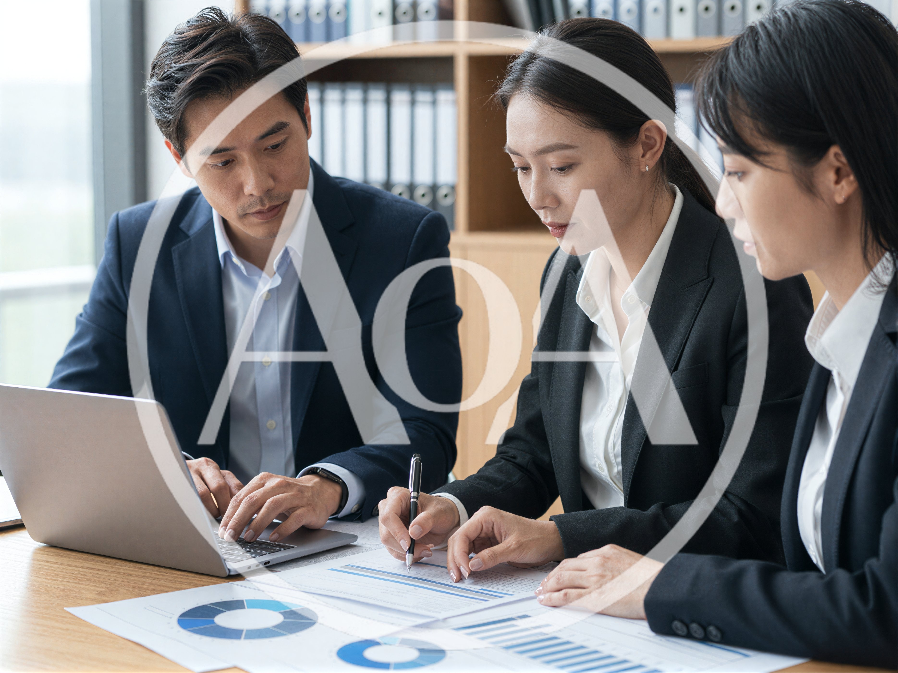 Business Professionals Collaborating on Financial Reports in Office