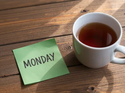 Monday Note on Wooden Table with Tea Cup