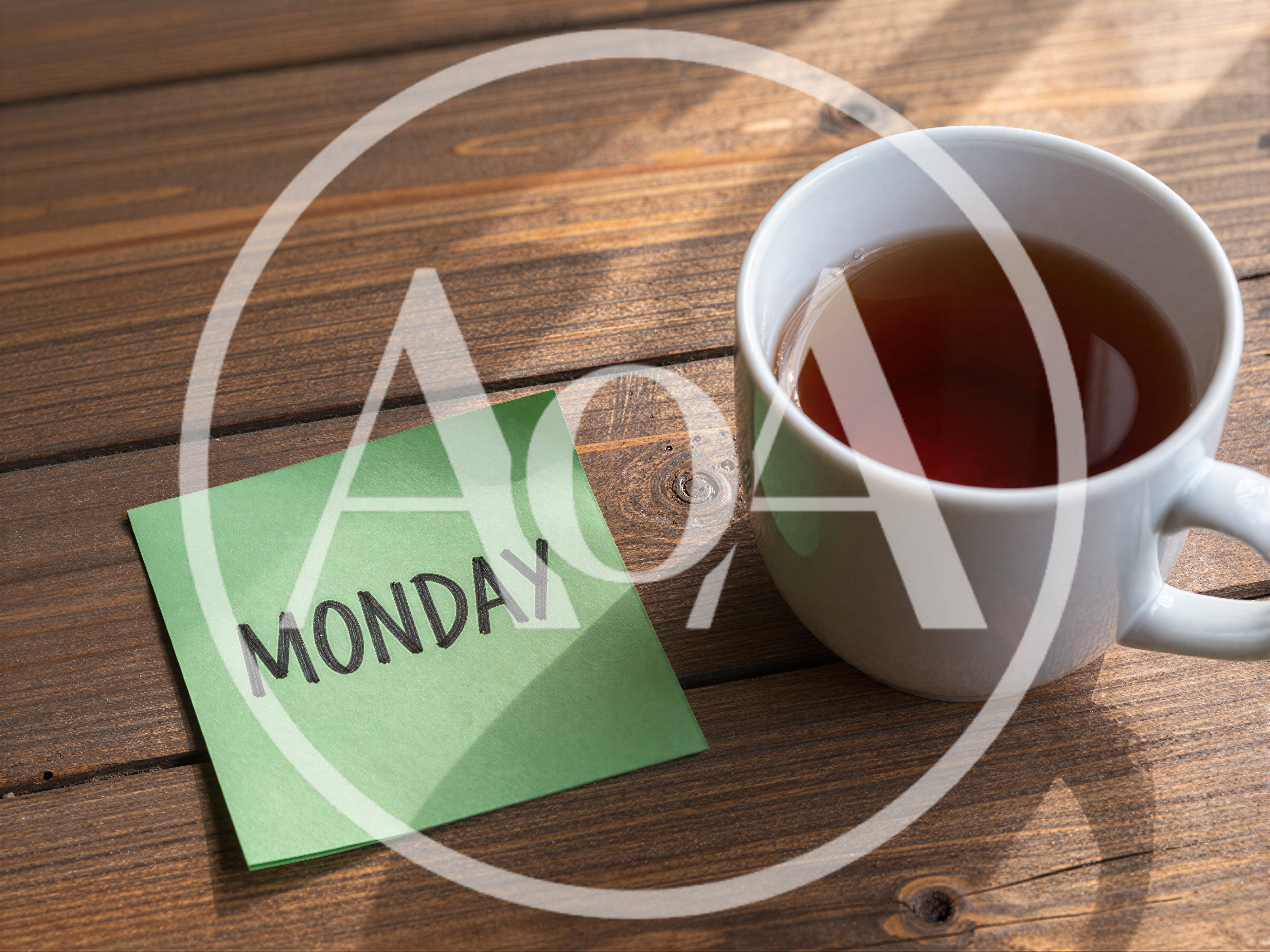 Monday Note on Wooden Table with Tea Cup