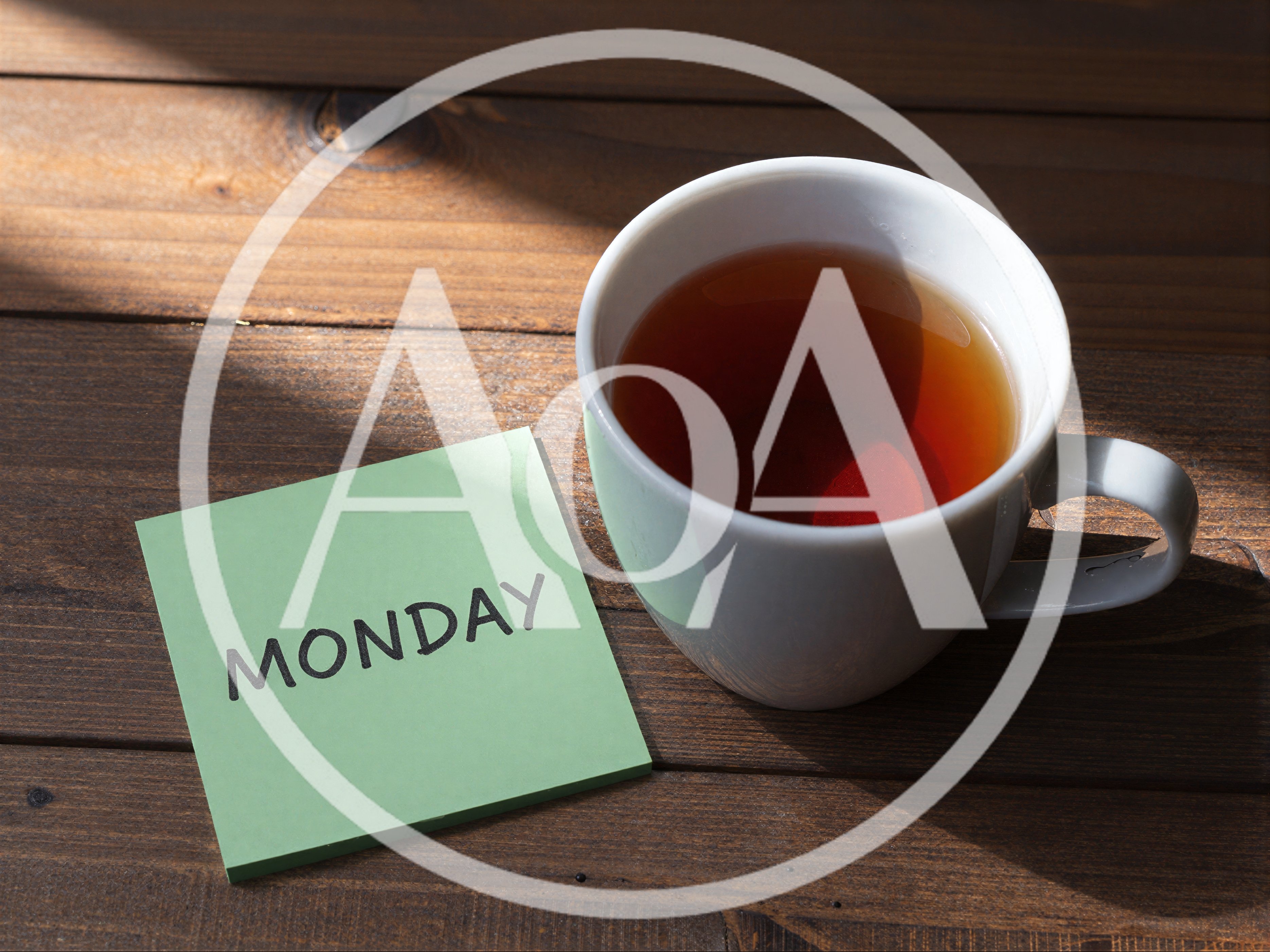 Green Sticky Note With Monday Text And Tea Cup