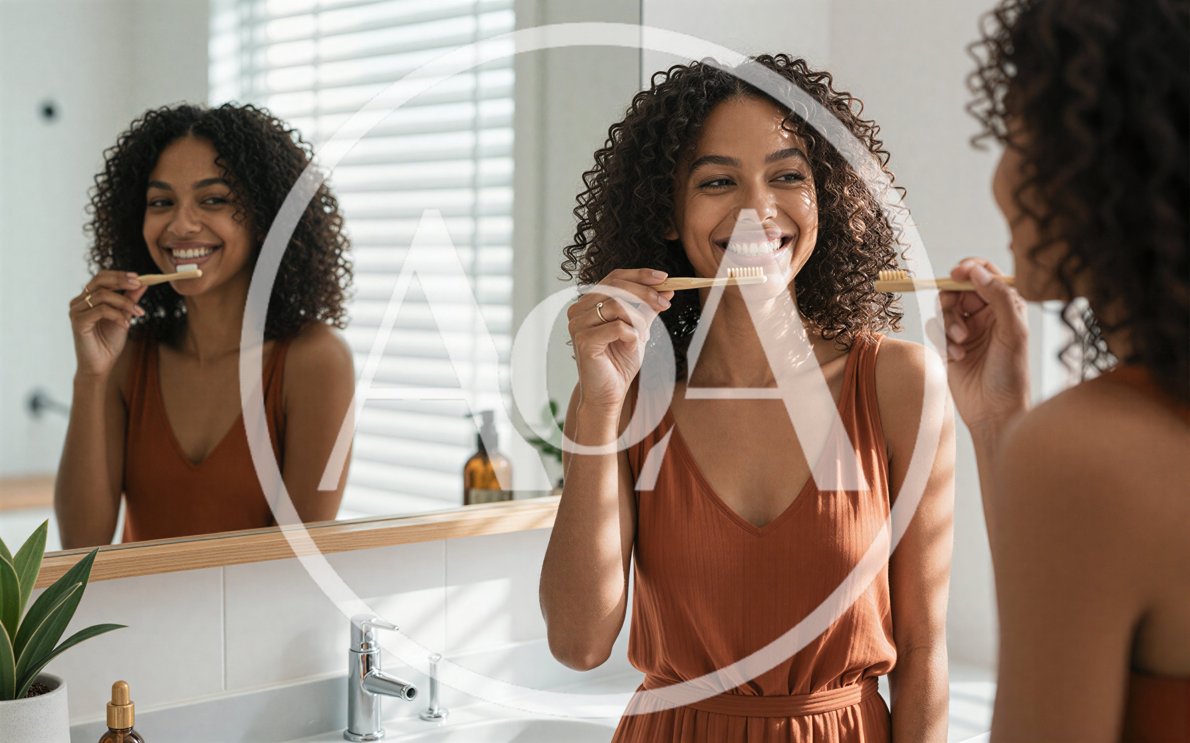 Young Woman Brushing Teeth In Bathroom Mirror