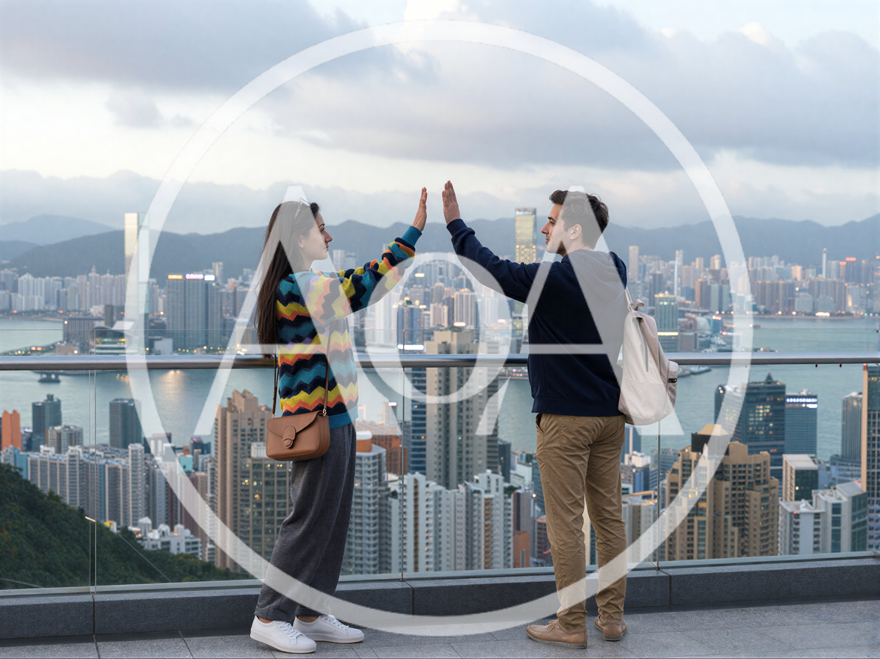 Couple Giving High Five Overlooking Hong Kong Skyline