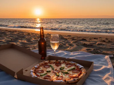 Pizza And Drinks On A Beach At Sunset