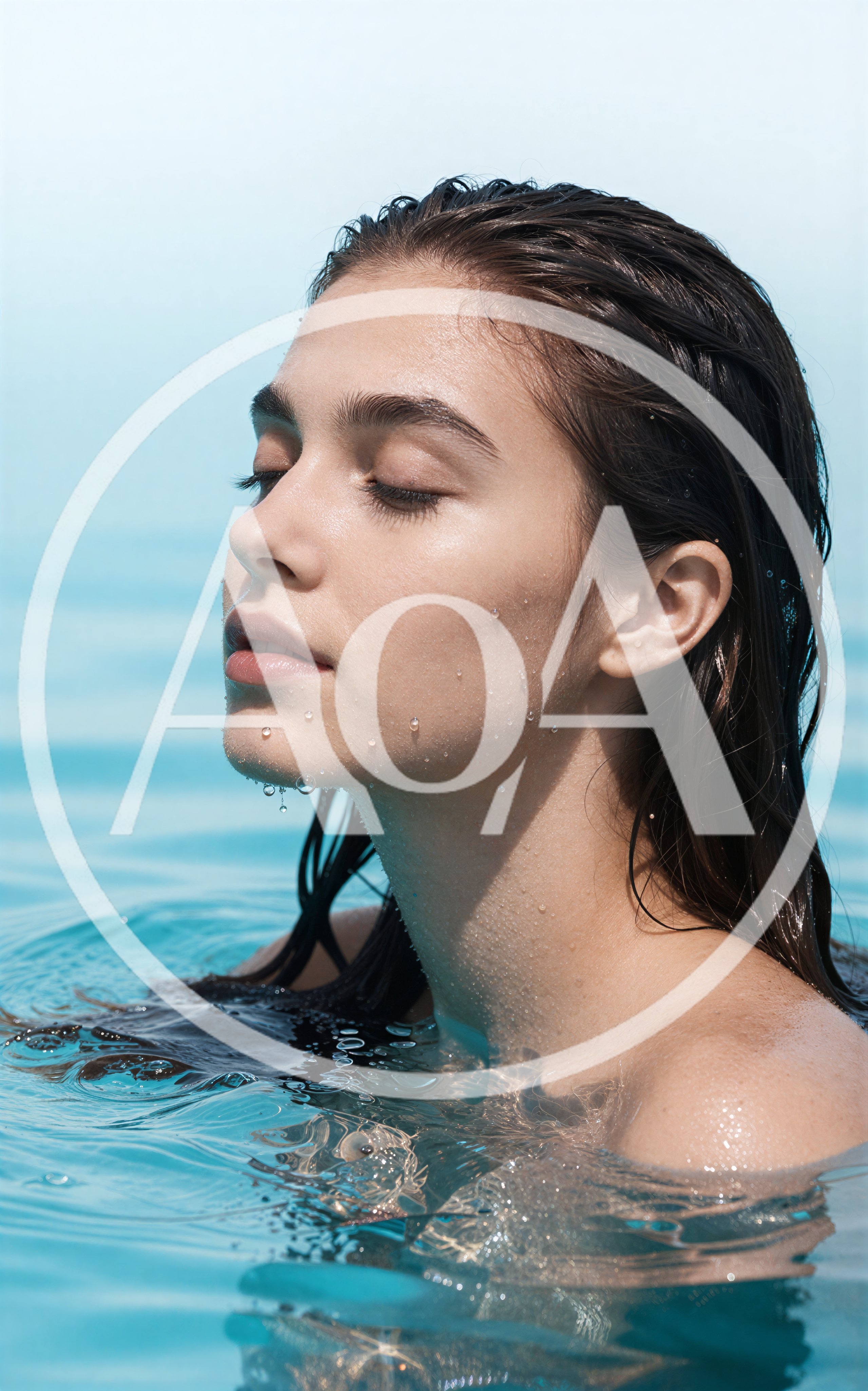 Young Woman Relaxing In Swimming Pool