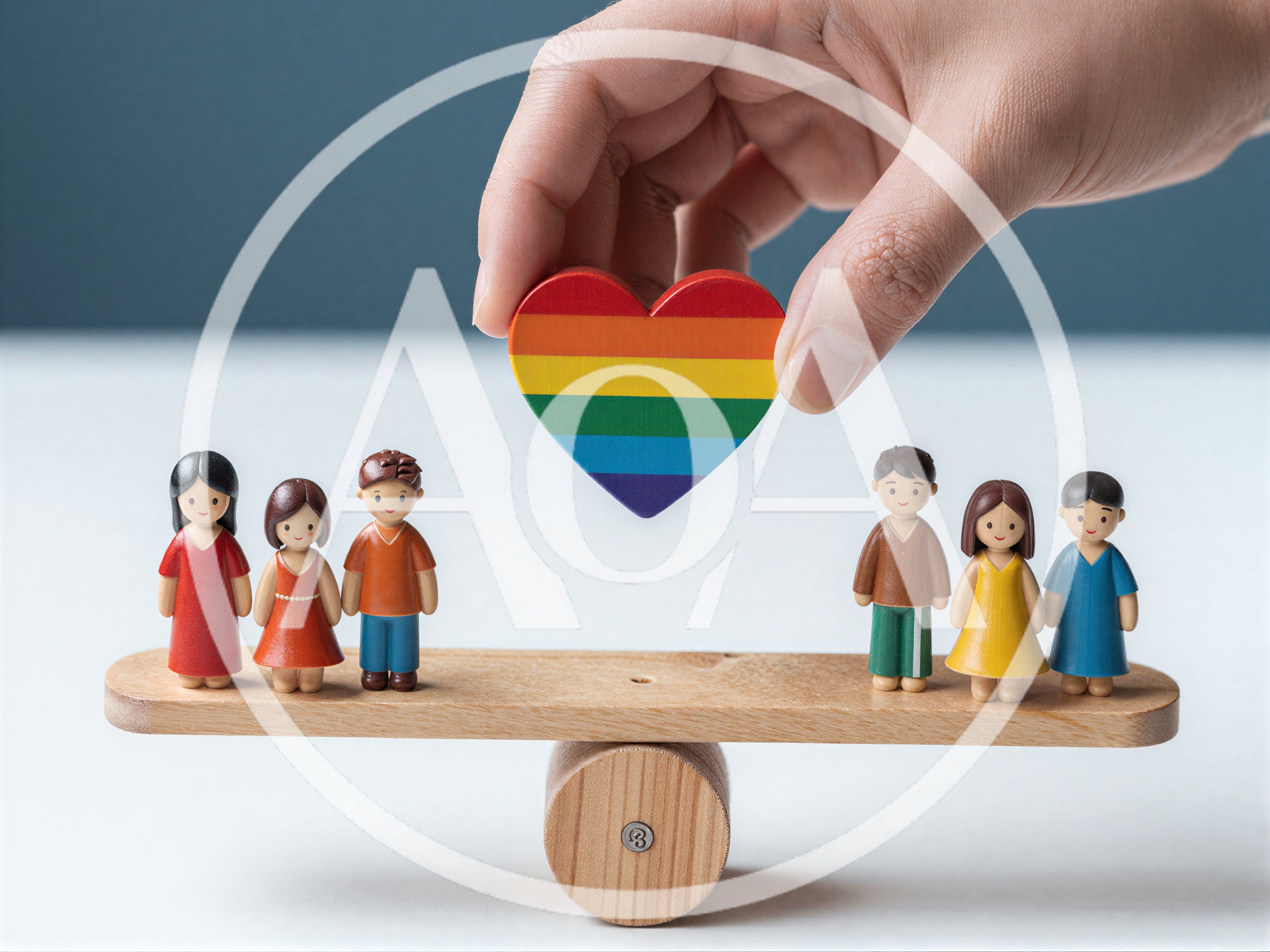 Hand Placing Rainbow Heart On Wooden Balance Scale