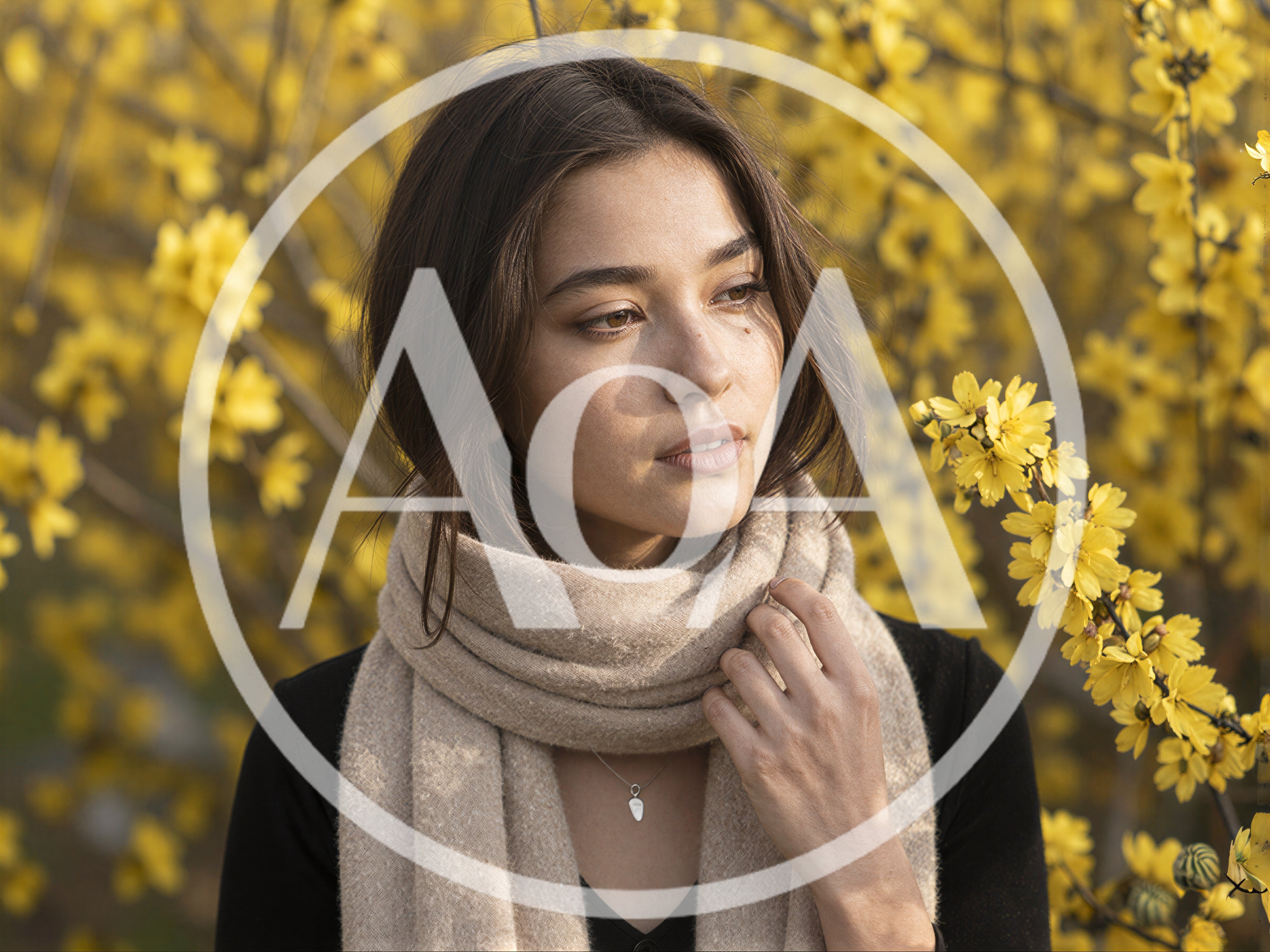 Young Woman Wearing Beige Scarf Among Yellow Flowers