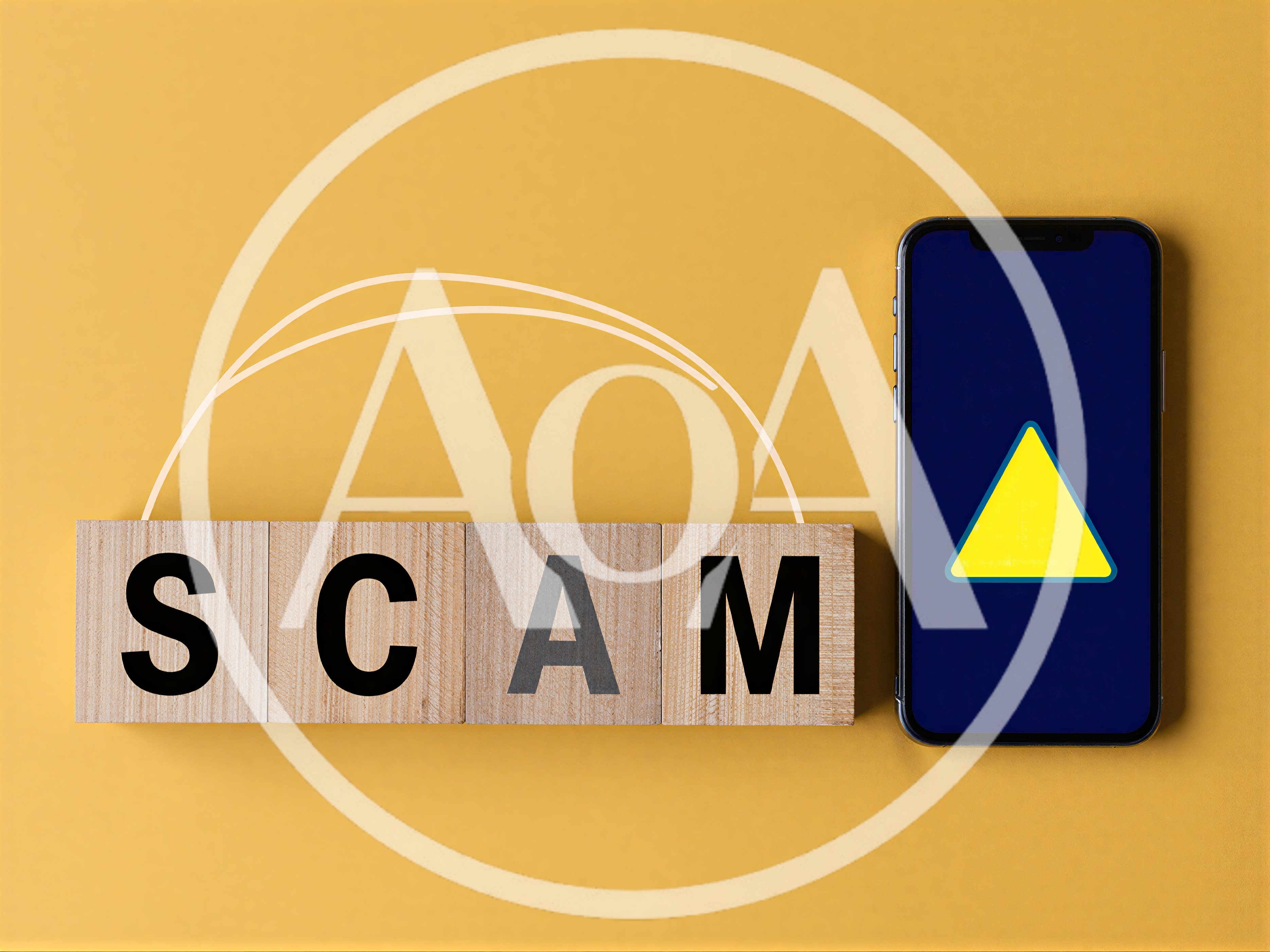 Wooden Blocks Spelling Scam Next To Smartphone With Warning Icon