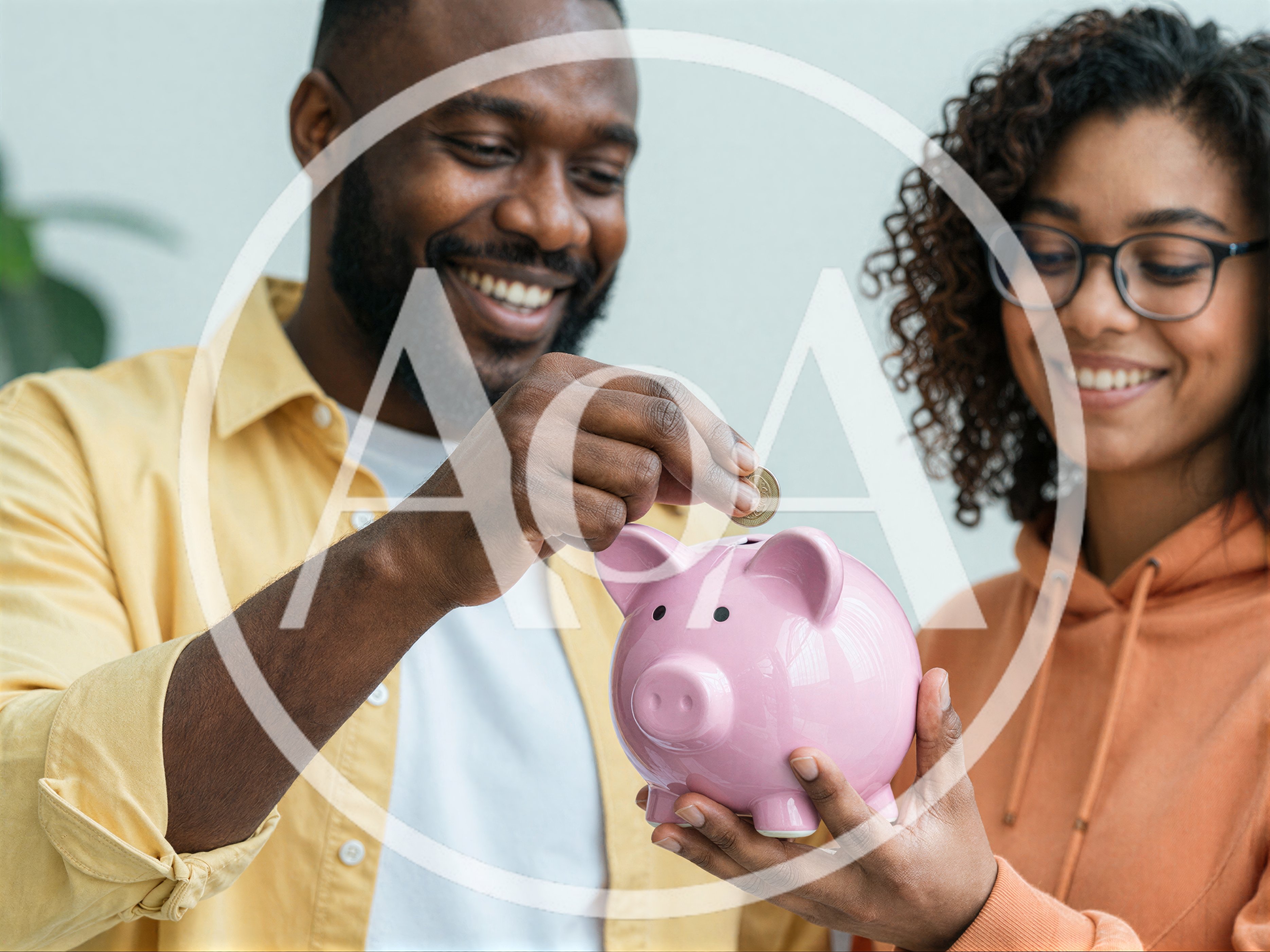 Happy Couple Saving Money In A Pink Piggy Bank