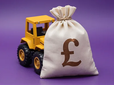 Toy Tractor With A British Pound Money Bag