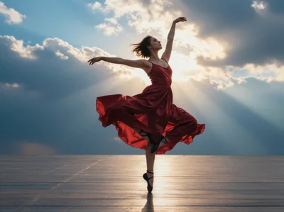 Ballerina Dancing In Red Dress Against Sunset Sky