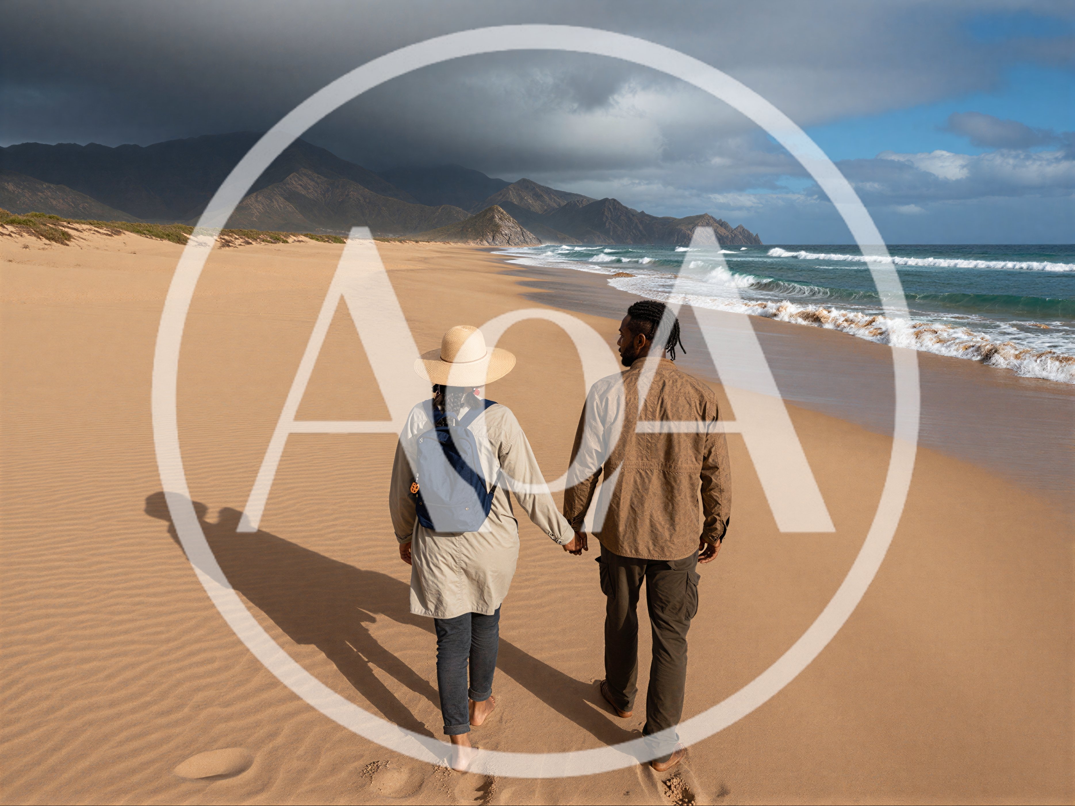 Couple Walking Hand In Hand On A Sandy Beach