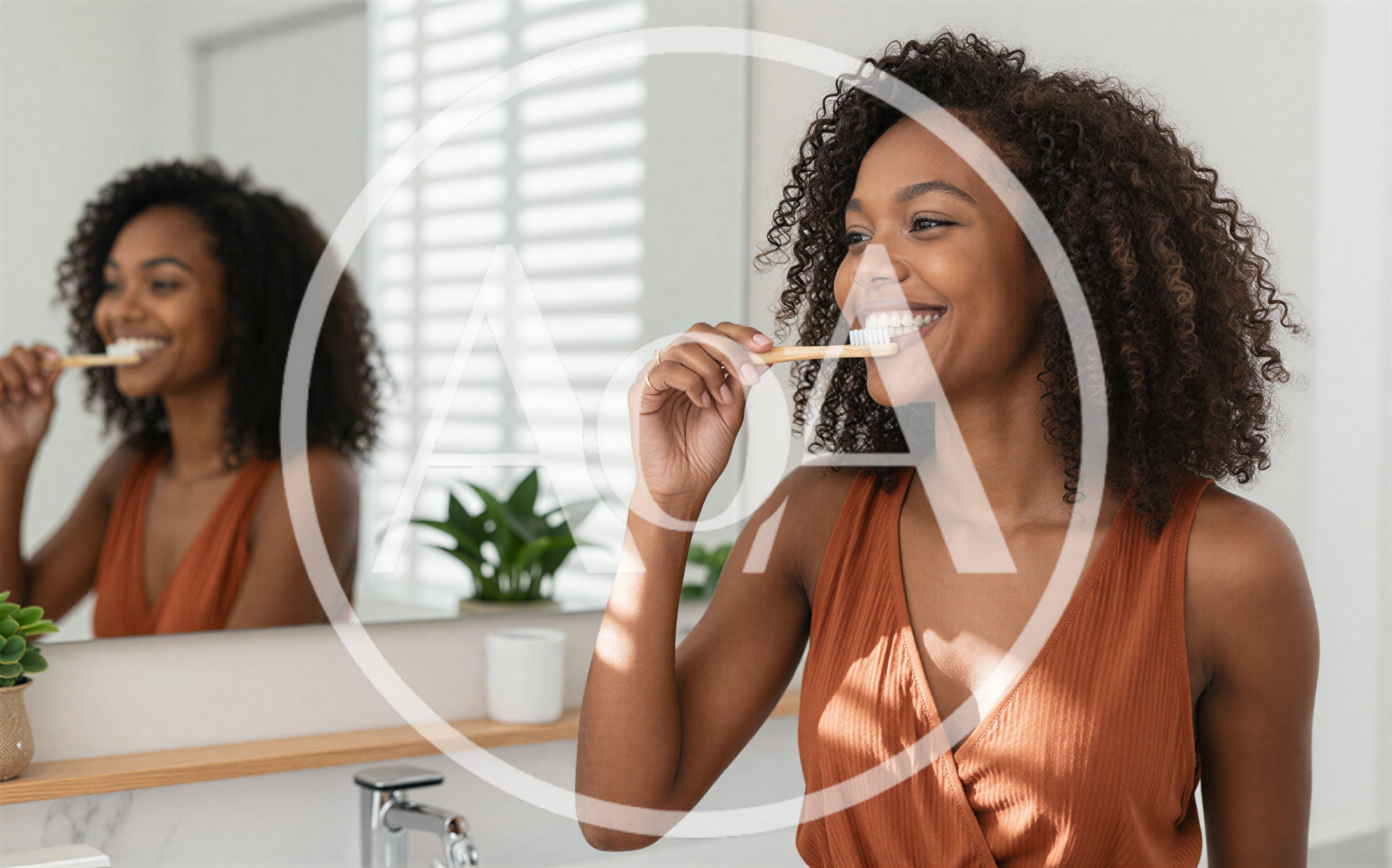 Young Woman Brushing Teeth With Bamboo Toothbrush