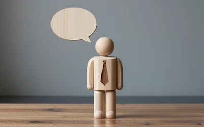 Wooden Mannequin Figure With Blank Speech Bubble