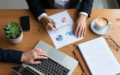 Business Professionals Collaborating on Financial Data Analysis