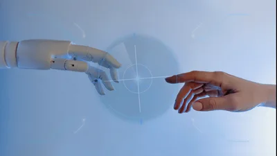 Robot Hand Reaching Toward Human Hand With Digital Interface