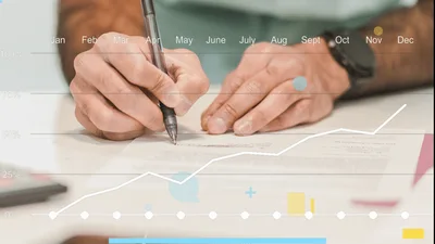 Businessman Signing Contract With Animated Financial Growth Chart Overlay