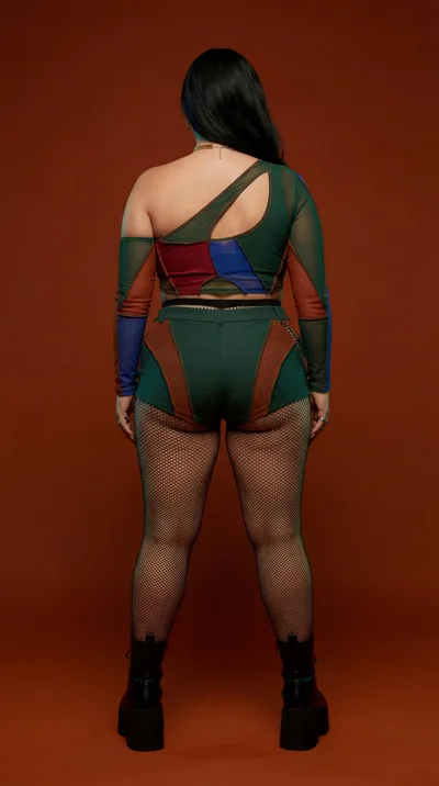 Back View Of A Woman In Colorful Patchwork Outfit